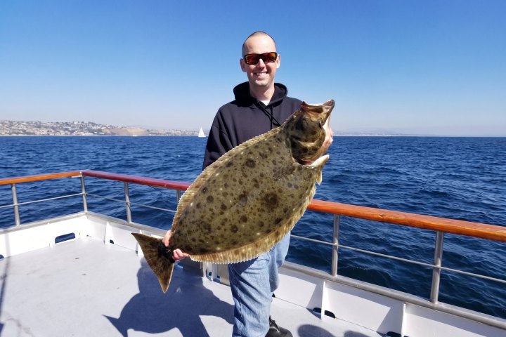 Angler with their catch on the Dana Wharf Halibut Derby out of Dana Point