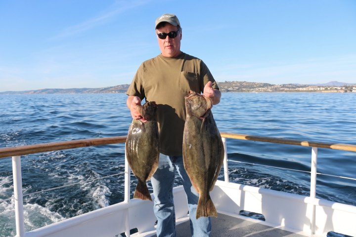 Angler with their catch on the Dana Wharf Halibut Derby out of Dana Point