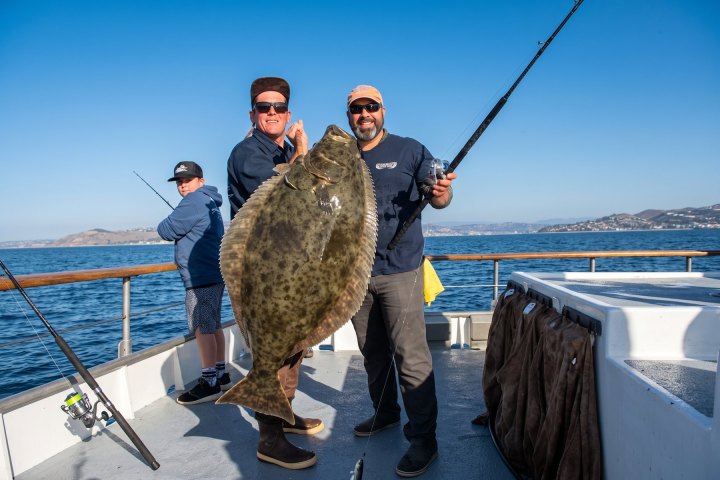 Angler with their catch on the Dana Wharf Halibut Derby out of Dana Point