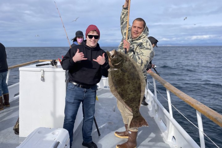 a person holding a fish