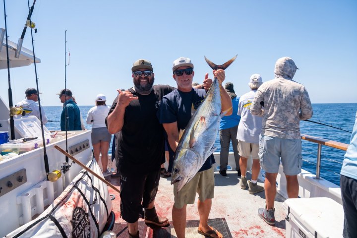 Two anglers with a tuna on a Dana Wharf offshore fishing trip