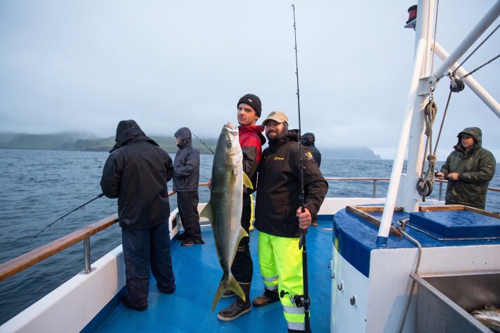 Angler with their catch on a Dana Wharf overnight fishing trip out of Dana Point