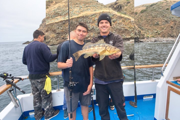Angler with their catch on a Dana Wharf overnight fishing trip out of Dana Point