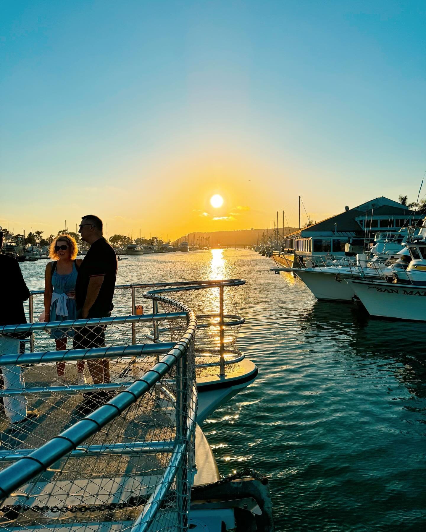 Sunset over Dana Point Harbor from the deck of a Dana Wharf boat