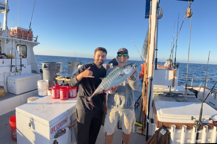 Two anglers with their catch on the deck of a Dana Wharf boat on a 3/4-day fishing trip