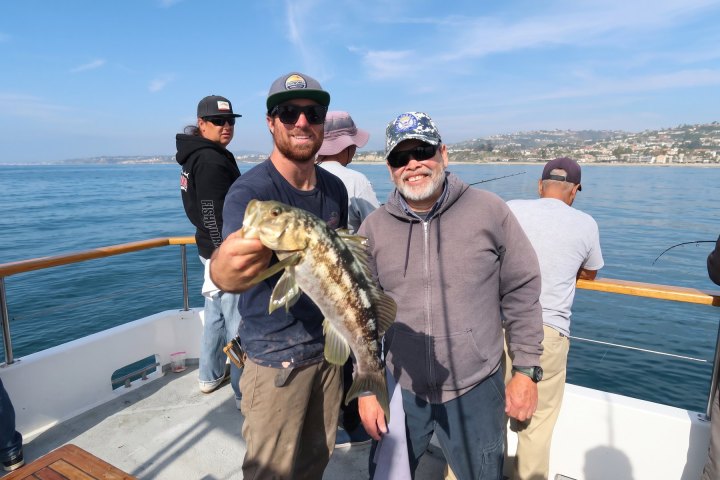 Angler with their catch on a Dana Wharf 3/4-day fishing trip out of Dana Point