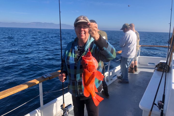 Angler with their catch on a Dana Wharf 3/4-day fishing trip out of Dana Point
