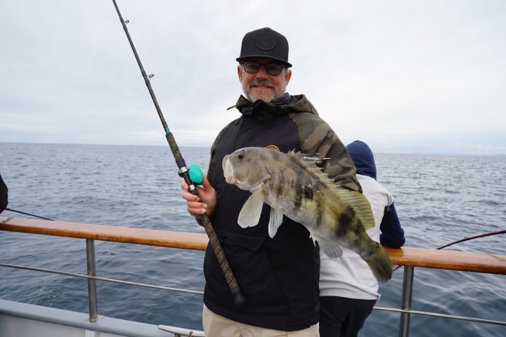 Angler with their catch on a Dana Wharf 3/4-day fishing trip out of Dana Point